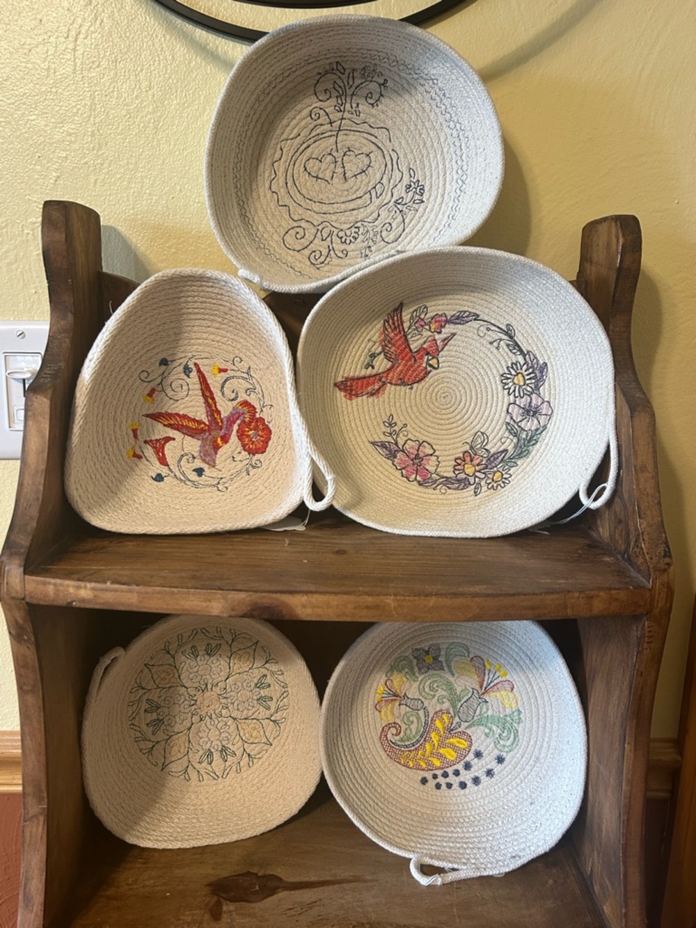 5 handcrafted coiled cotton rope bowls featuring machine embroidery designs